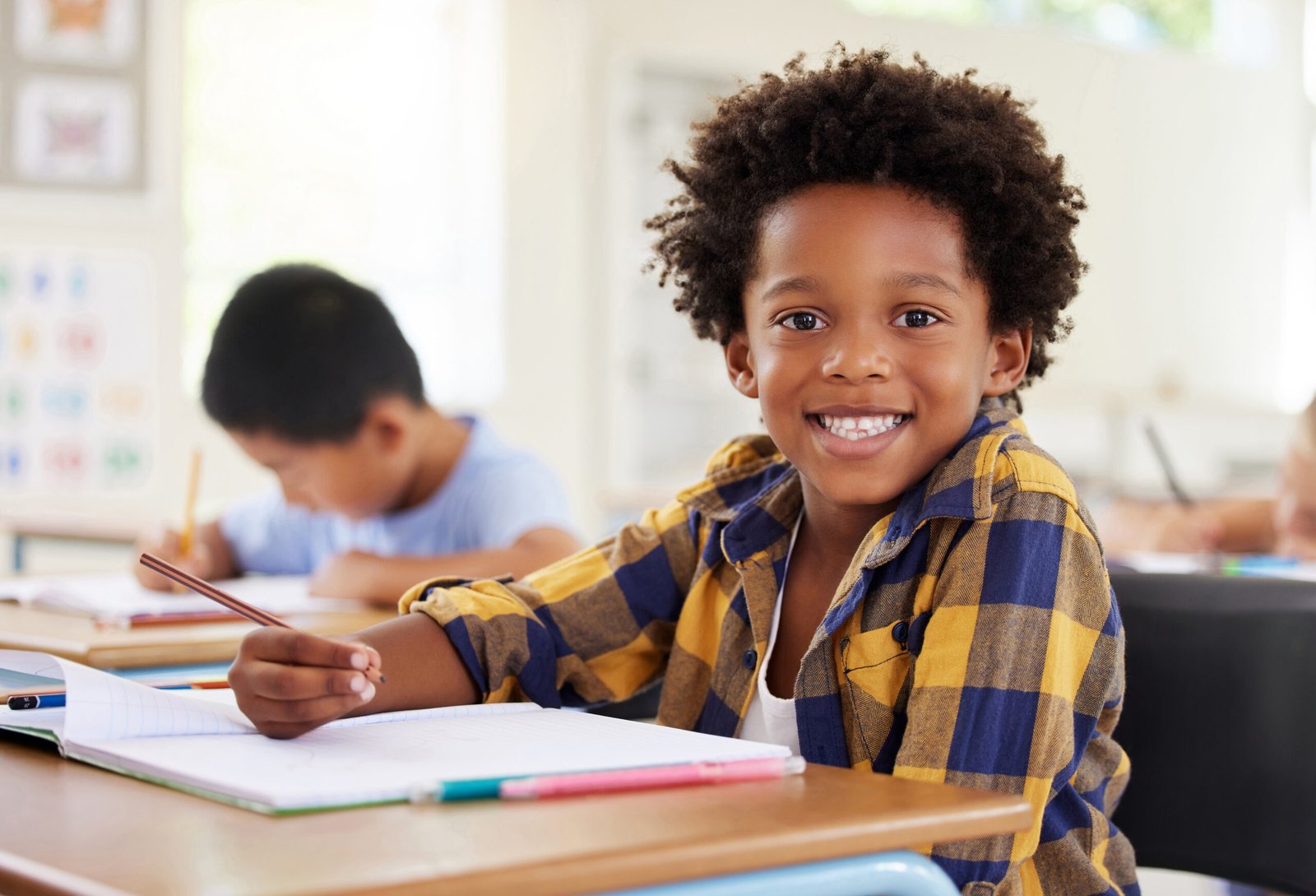 We love colouring. Shot of a preschooler colouring in class Child coloring in a classroom
